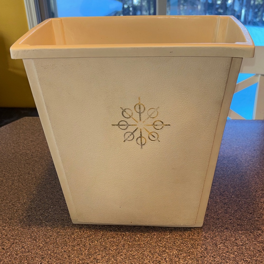 Elegant Cream Wastebasket with Decorative Motif
